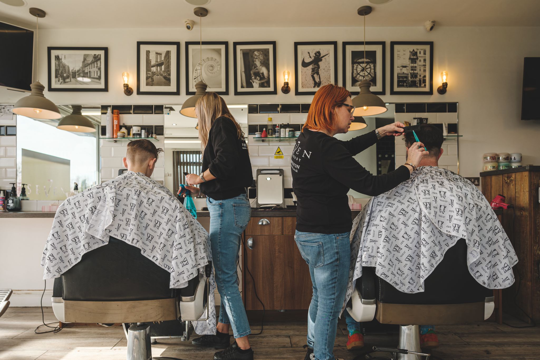 Two ladies cutting hair at Seven hair and body barbers in peterborough